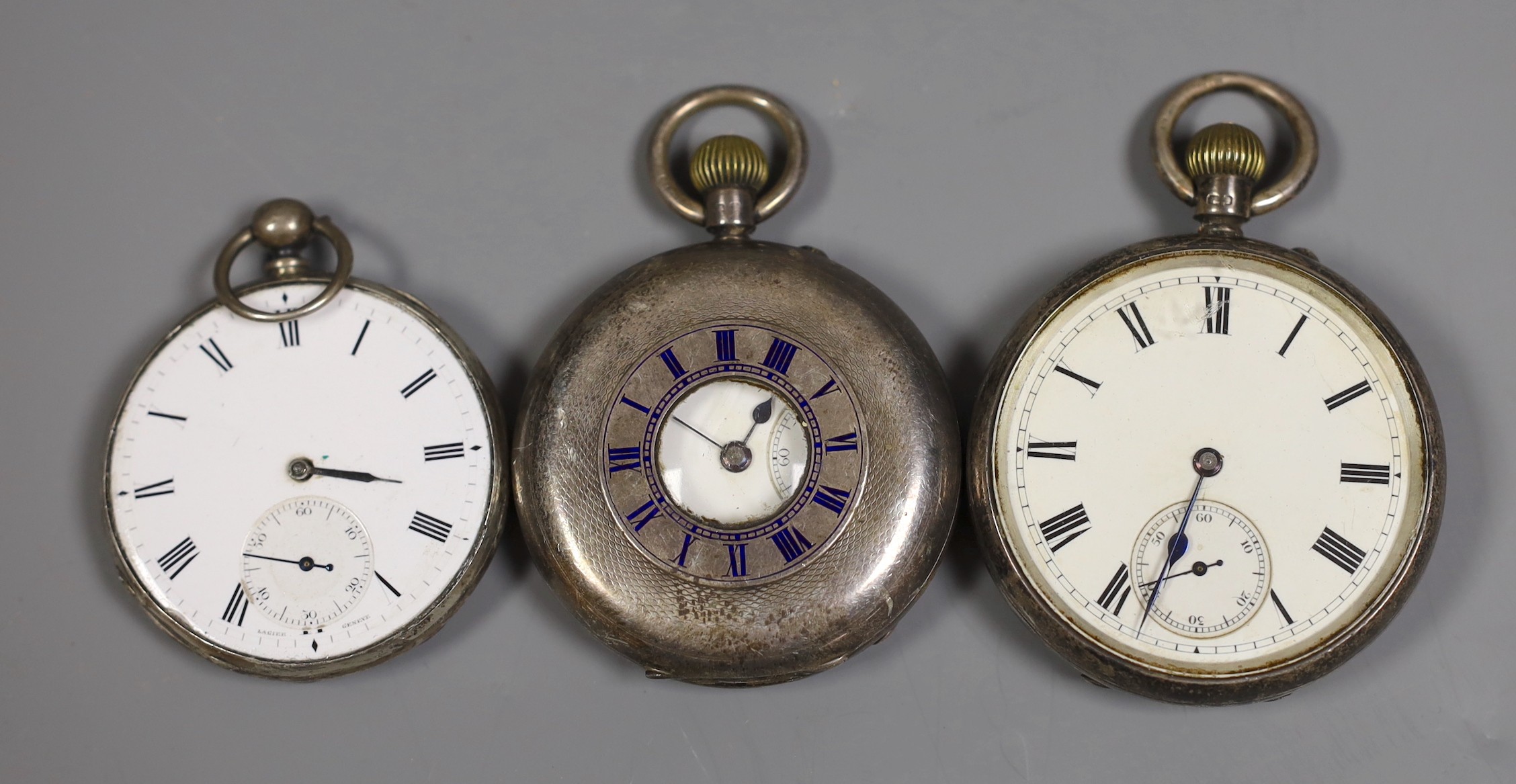 Two silver pocket watches including half hunter and one other white metal open faced pocket watch(lacking glass).